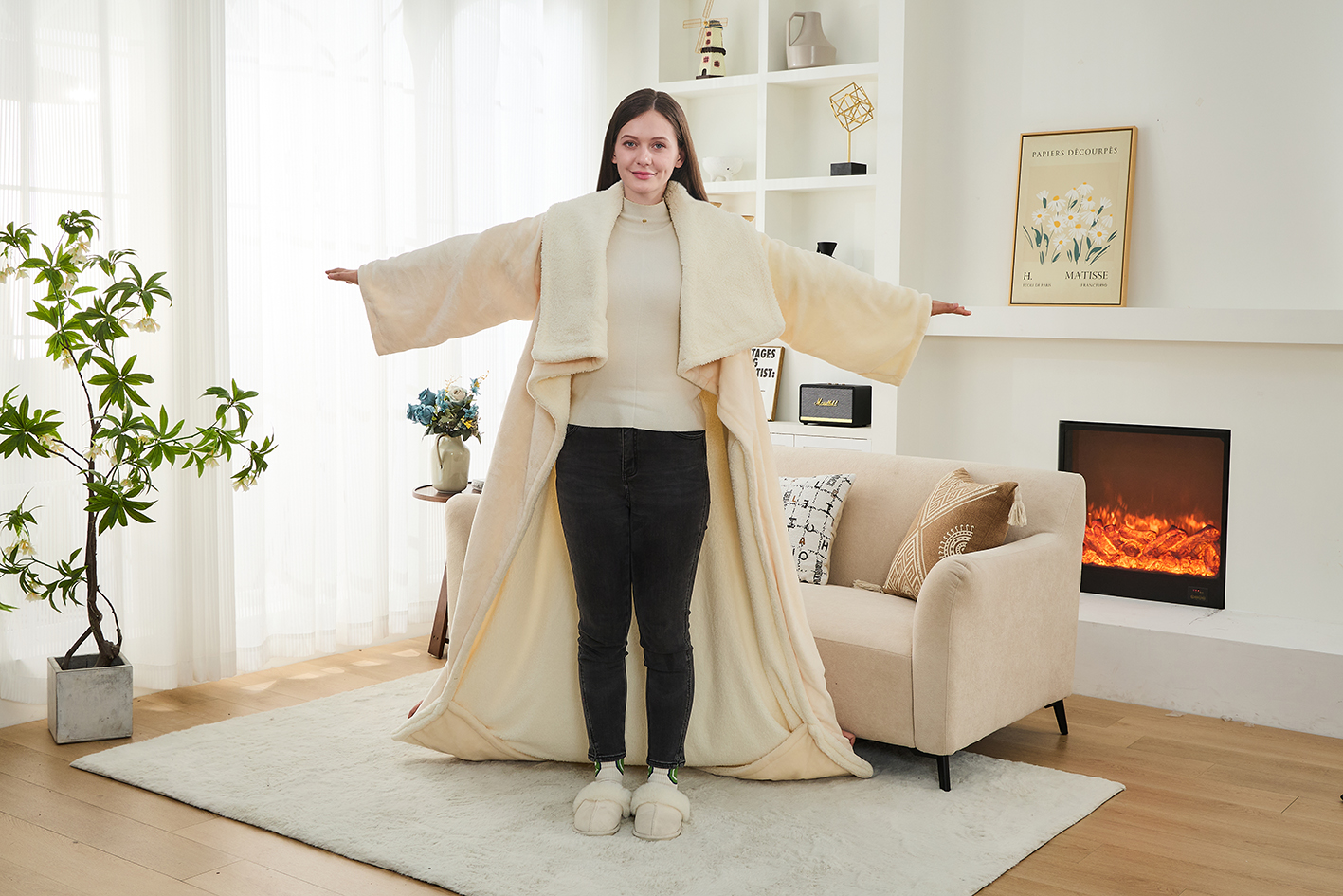 Wearable heated blanket with sleeves and integrated heated foot pocket